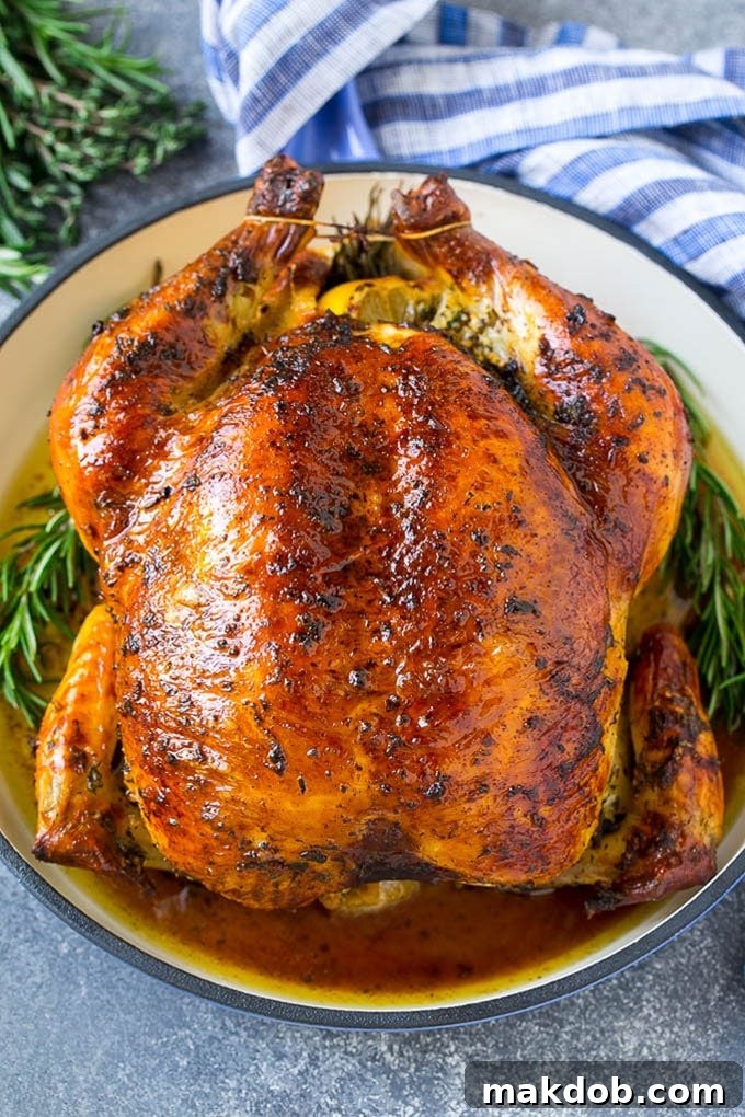 This chicken brine recipe is made with lemons, honey, fresh herbs and spices, and produces a juicy tender chicken every time! A foolproof way for succulent and flavorful roasted, smoked or fried chicken. A beautifully brined and roasted whole chicken, golden brown and glistening, presented on a cutting board, ready to be carved.