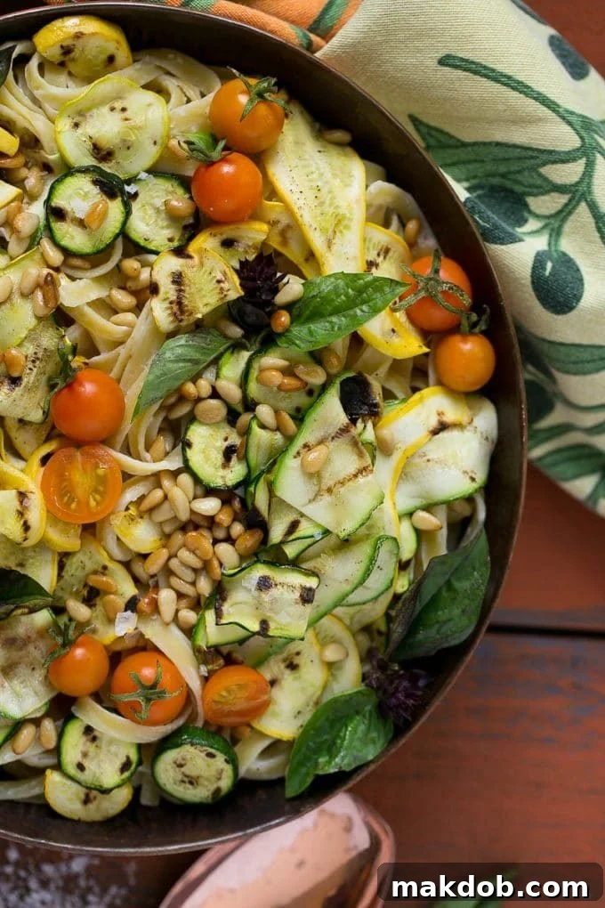 Zucchini Fettuccine Alfredo Recipe | Healthy Zucchini Fettuccine Alfredo | Lighter Zucchini Fettuccine Alfredo | Best Zucchini Fettuccine Alfredo Fettuccine Alfredo tossed with grilled zucchini, sweet cherry tomatoes, and crunchy pine nuts.