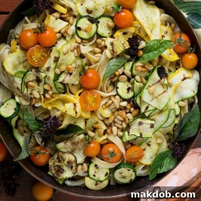 Light Zucchini Fettuccine Alfredo 2 This zucchini fettuccine alfredo features a healthier remake of the classic sauce (no cream!) with the addition of grilled zucchini, cherry tomatoes and pine nuts.
