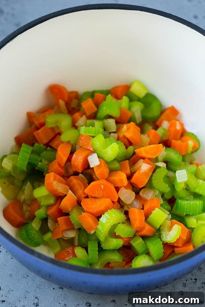 Lentil Soup Recipe | Sausage Lentil Soup #soup #lentils #sausage #dinner #glutenfree #dinneratthezoo Sauteed carrot, celery and onion in a soup pot.