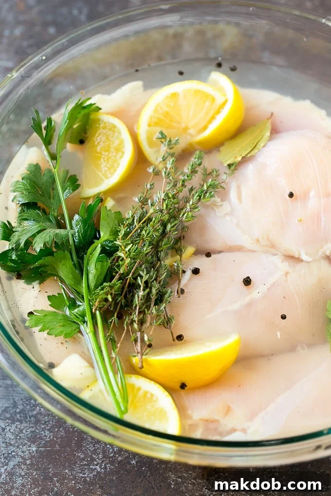 Smoked Chicken Breast Recipe | BBQ Chicken | Smoked Chicken #bbq #chicken #smoker #dinner #glutenfree #dinneratthezoo Chicken breasts in a bowl of brine with lemon and herbs, infusing flavor.