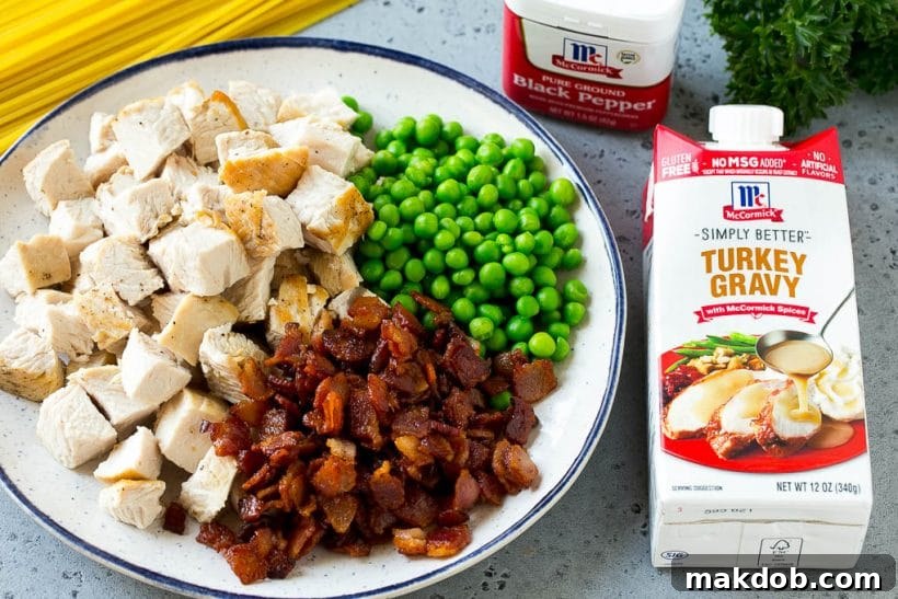 A selection of ingredients laid out: McCormick Simply Better Turkey Gravy, cooked turkey, spaghetti, peas, and bacon – essential for delicious carbonara.