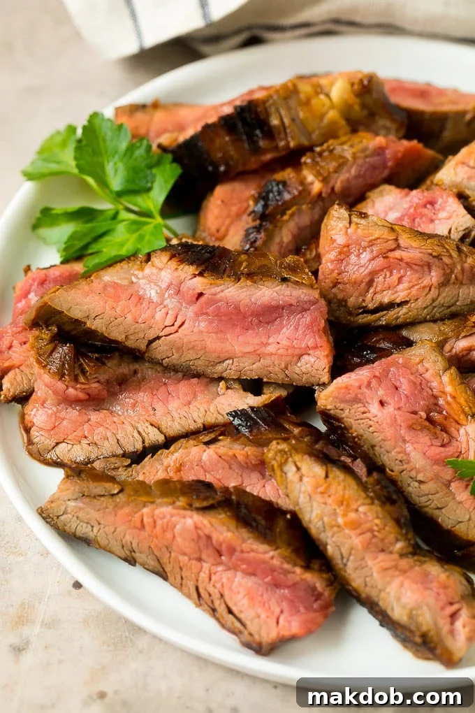 Flank steak marinade flavored meat that's been thinly sliced, ready to serve.