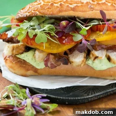 This updated club sandwich includes lemon herb grilled chicken, homemade avocado ranch spread, plenty of bacon and lots of summer tomatoes.