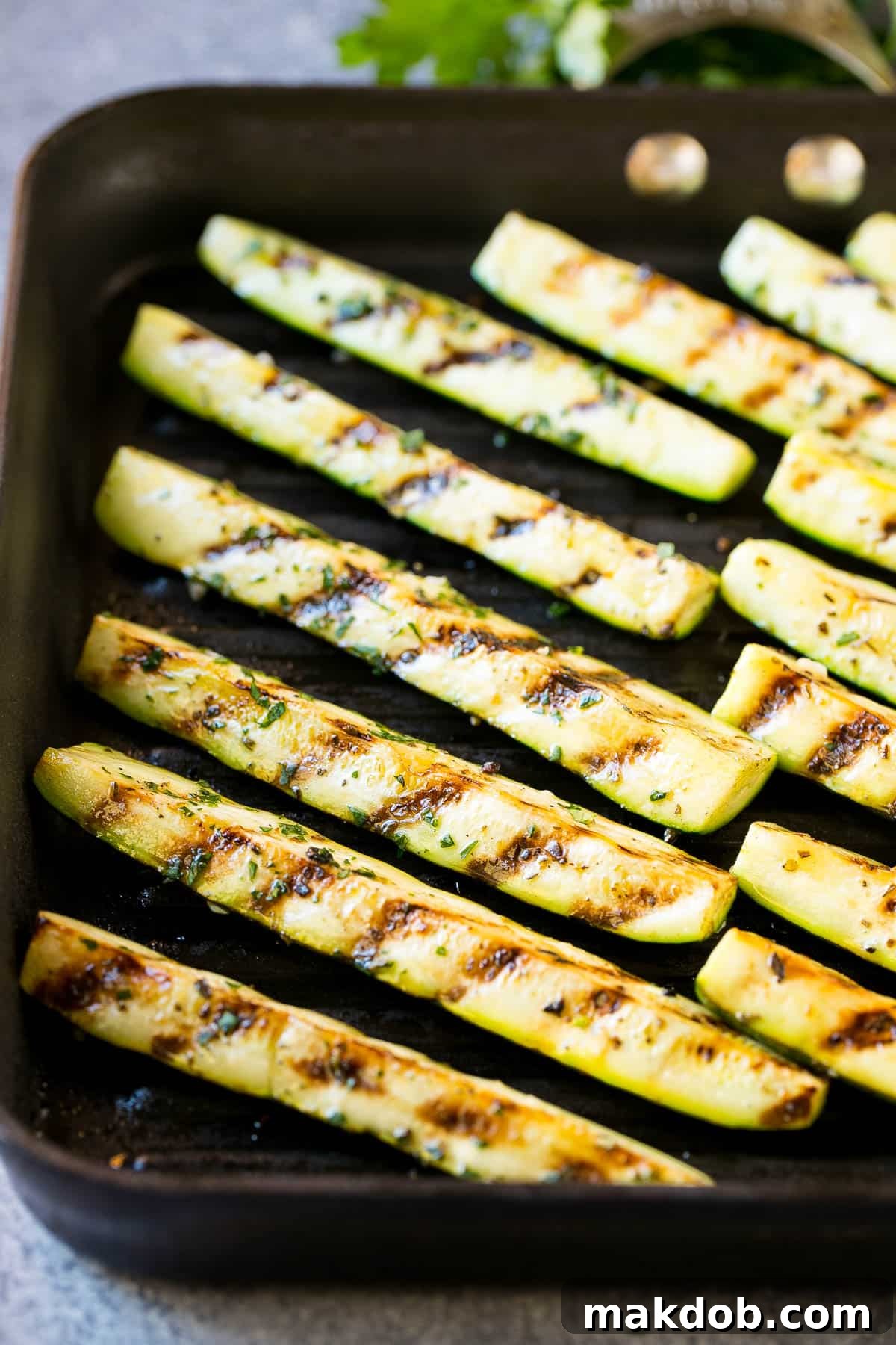 Perfectly cooked vegetable spears with visible grill marks, prepared on a grill pan, ready to be served.