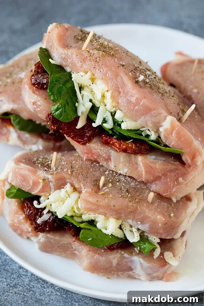 Stuffed Pork Chops Recipe | Boneless Pork Chops Recipe | Italian Pork Chops #pork #porkchops #cheese #lowcarb #dinner #dinneratthezoo Boneless pork chops split open and stuffed with fresh spinach, sun-dried tomatoes, and shredded mozzarella cheese.