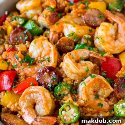 A pan of jambalaya made with shrimp, sausage, chicken, rice and vegetables.