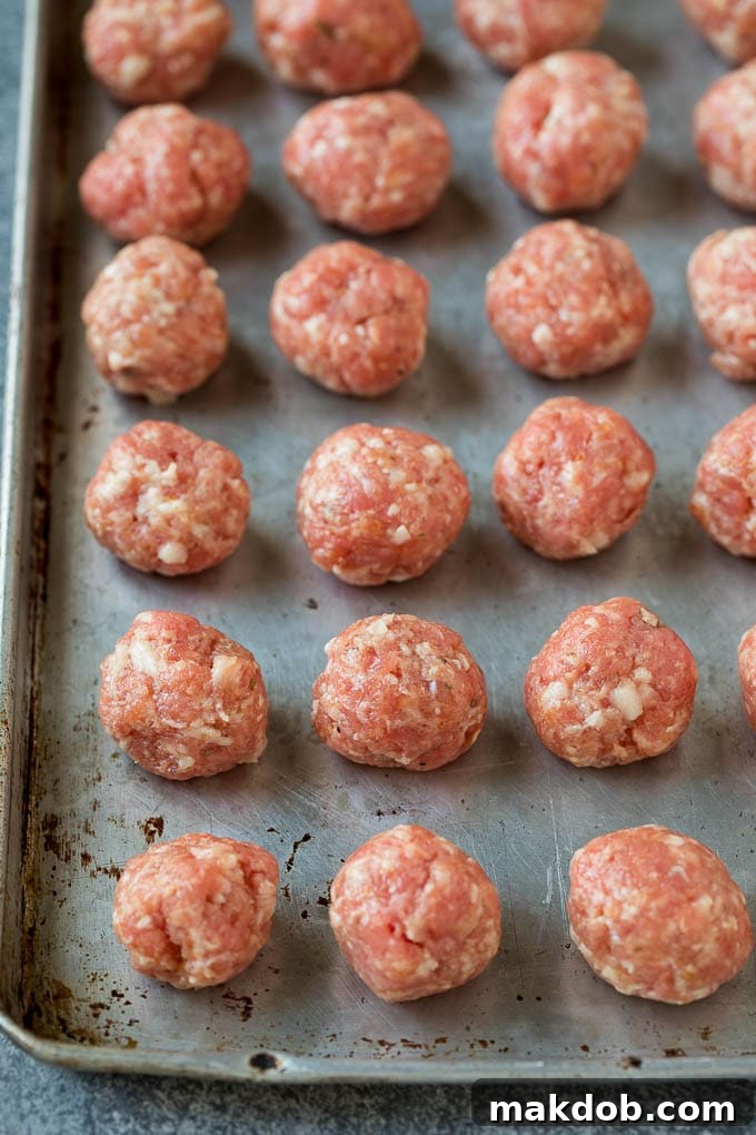 Meatballs on a baking sheet.