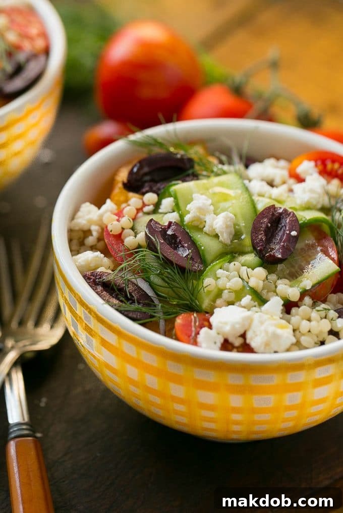 Greek couscous topped with vegetables and feta cheese.