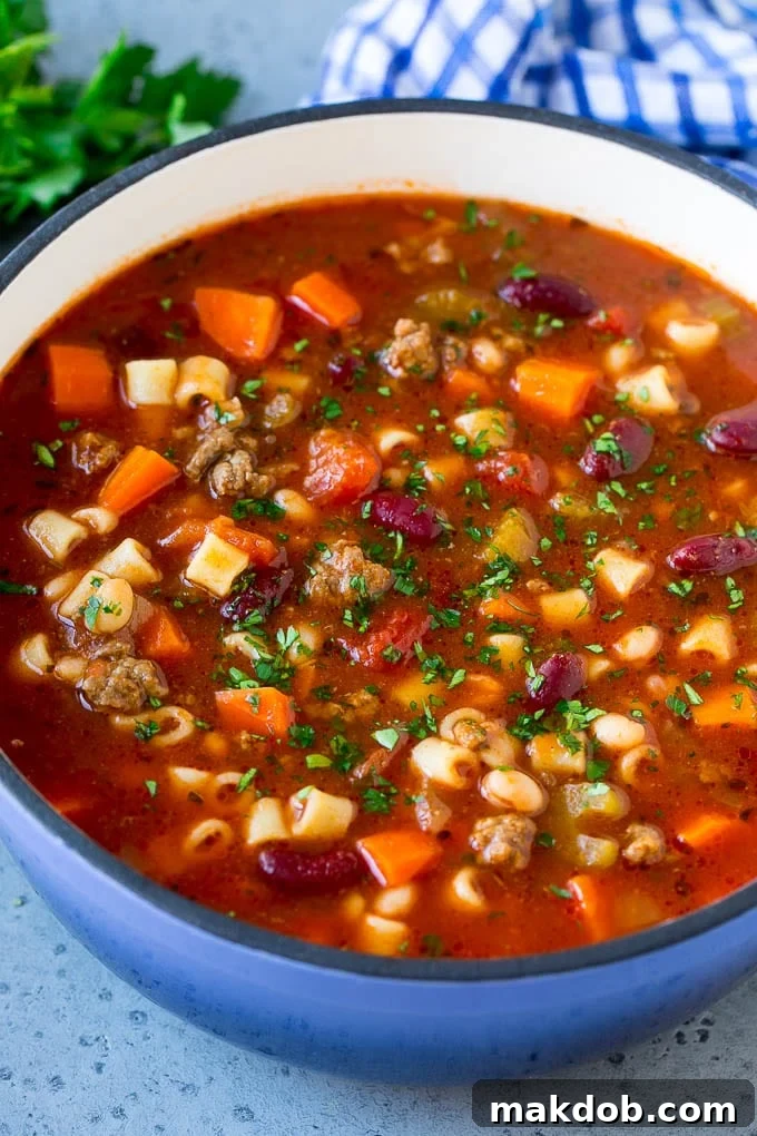 A pot of pasta e fagioli soup made with ground beef, vegetables, beans and pasta.
