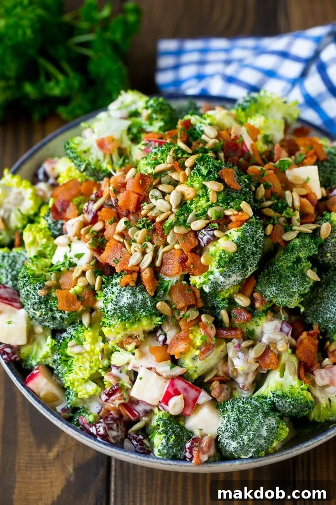 Broccoli Salad Recipe | Creamy Broccoli Salad | Bacon Broccoli Salad #salad #broccoli #bacon #apple #dinneratthezoo #sidedish Broccoli salad in a creamy dressing topped with sunflower seeds and bacon.
