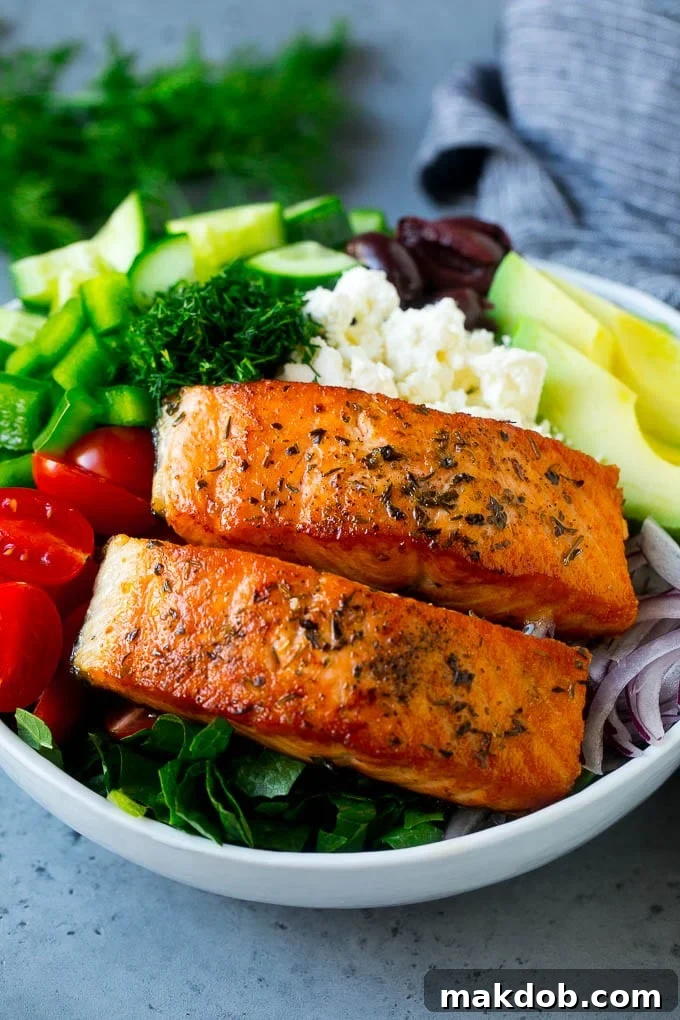 Greek Salmon Salad Recipe | Low Carb Salmon Recipe | Salmon Salad #salmon #seafood #fish #lowcarb #keto #lunch #dinneratthezoo #healthy Salmon fillets on lettuce with tomatoes, feta cheese, avocado, olives, cucumbers and herbs.