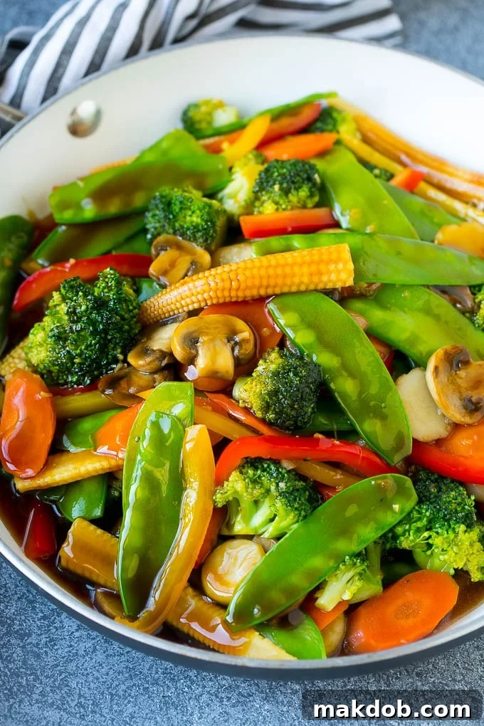 Vegetable Stir Fry Recipe | Veggie Stir Fry | Broccoli Stir Fry #vegetarian #vegetables #broccoli #dinner #dinneratthezoo A vibrant vegetable stir fry showcasing a medley of sautéed vegetables bathed in a glossy honey garlic sauce, ready to be served.