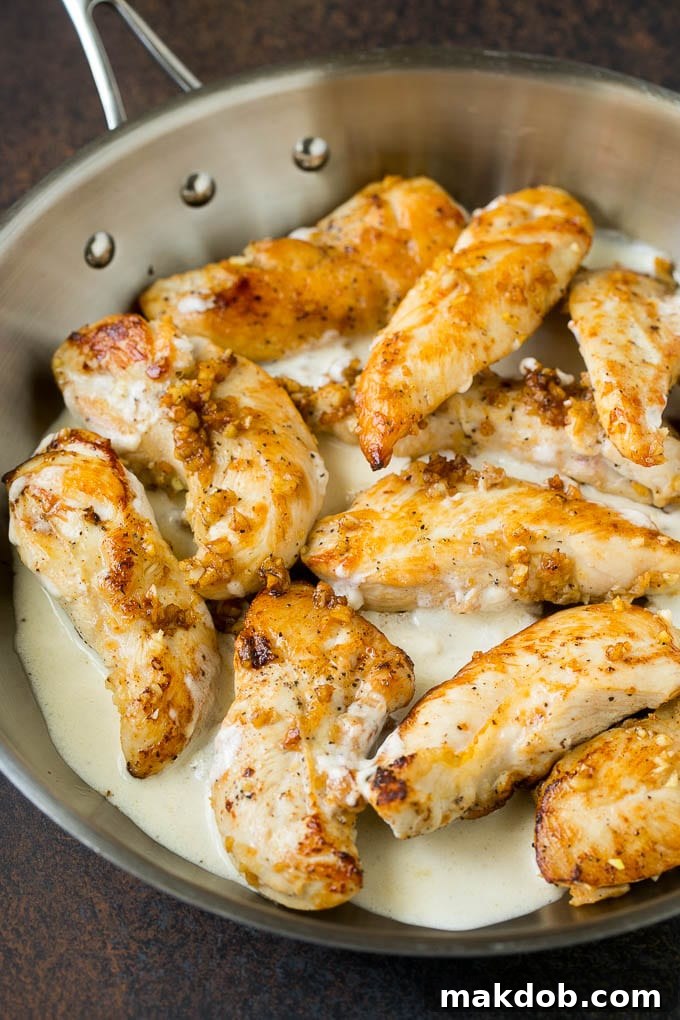 Creamy Garlic Chicken Recipe | Chicken Breast Tenders | Sauteed Chicken #chicken #garlic #parmesan #dinner #glutenfree #keto #lowcarb #dinneratthezoo Sauteed chicken breast tenders in a pan of cream sauce.