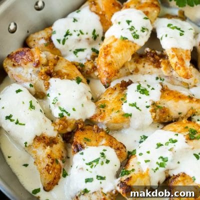 Creamy Garlic Chicken Delight 2 A pan of garlic chicken in a creamy parmesan sauce.