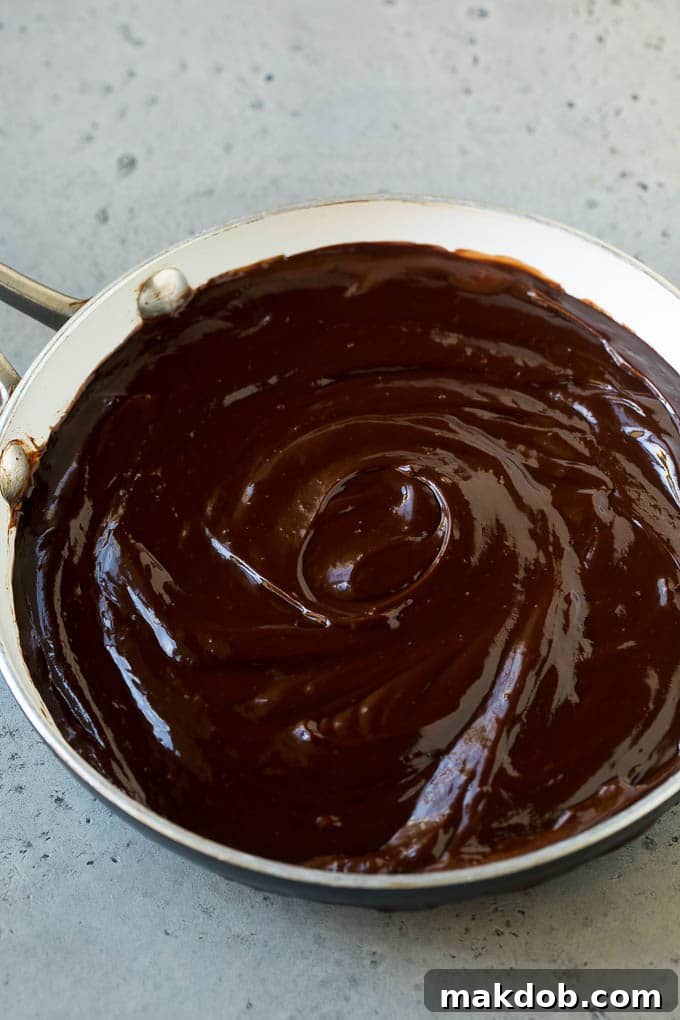 Melted chocolate dip in a skillet, showcasing its smooth, glossy texture.