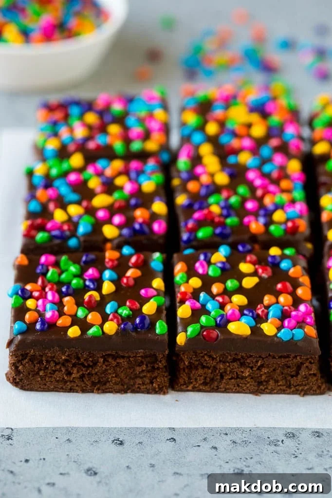 Cosmic brownies topped with chocolate fudge and crunchy rainbow sprinkles.