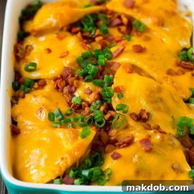 Ultimate Pierogi Bake 2 A baked pierogi casserole topped with melted cheese, bacon and green onions.