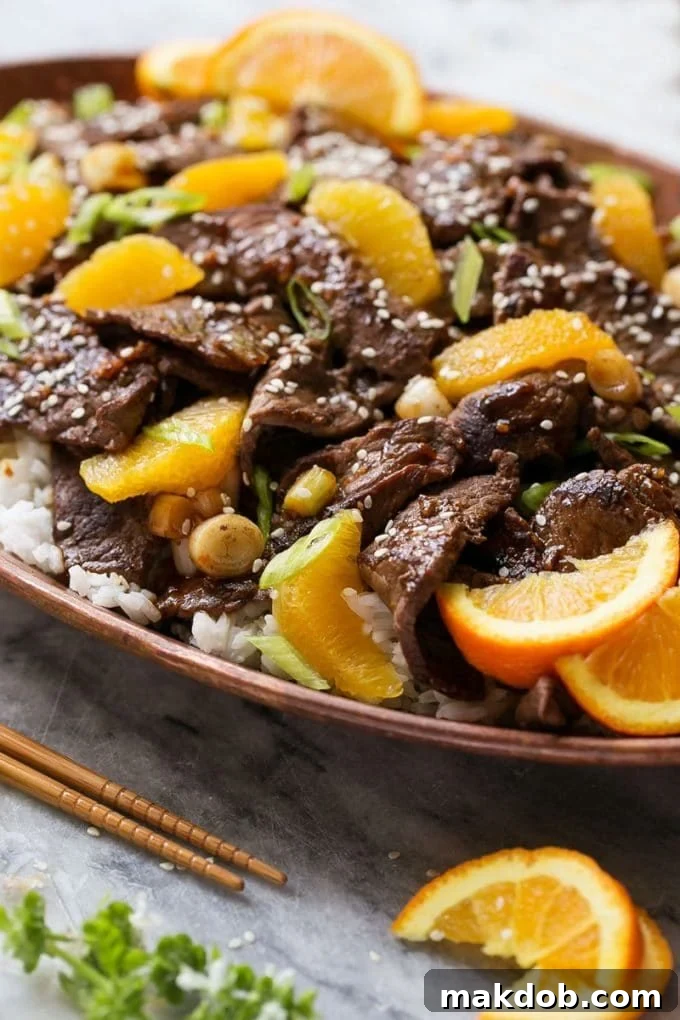 A small bowl containing the amber-colored 4-ingredient orange sauce for the stir fry.