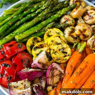 A colorful platter of grilled vegetables flavored with garlic and herbs.