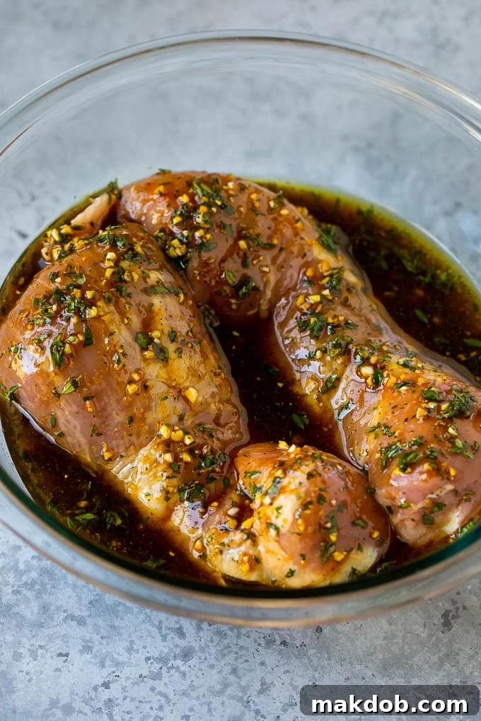 Marinated Pork Tenderloin Recipe | Pork Tenderloin Marinade | Pork Marinade #pork #porktenderloin #marinade #dinner #grilling #dinneratthezoo Pork tenderloins in a bowl of marinade.