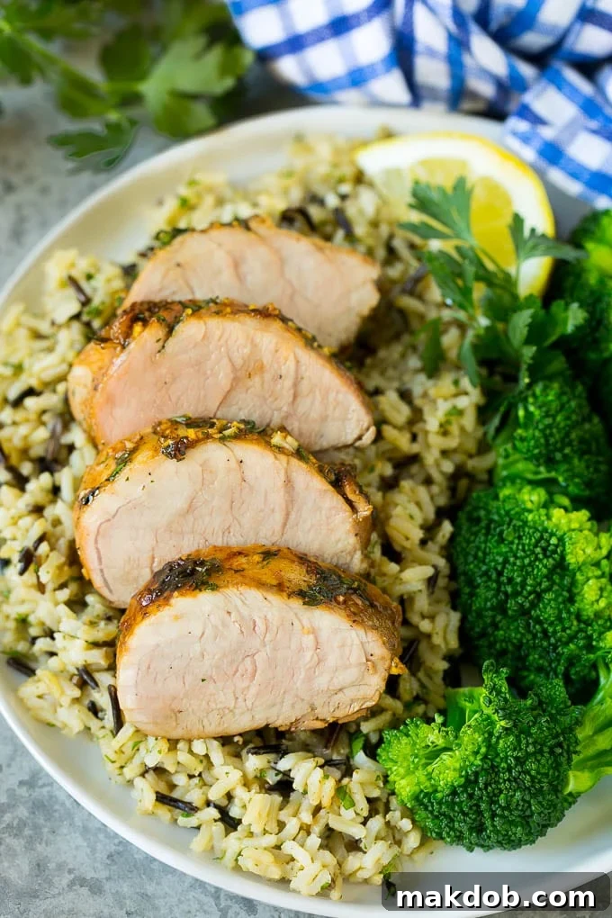 Marinated Pork Tenderloin Recipe | Pork Tenderloin Marinade | Pork Marinade #pork #porktenderloin #marinade #dinner #grilling #dinneratthezoo Pork tenderloin marinade over sliced pork, served with rice and broccoli.
