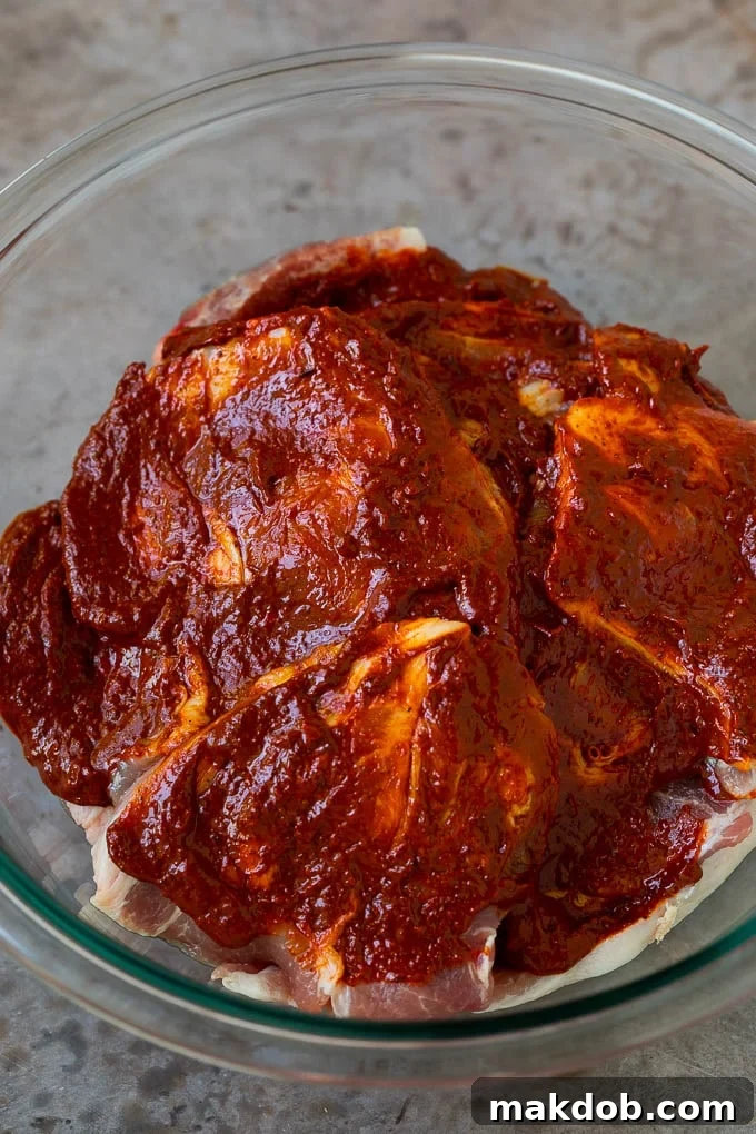 Tacos al Pastor Recipe | Pork Tacos | Mexican Tacos #tacos #pork #pineapple #grilling #tacotuesday #dinner #dinneratthezoo Sliced pork shoulder coated in a chile based marinade.
