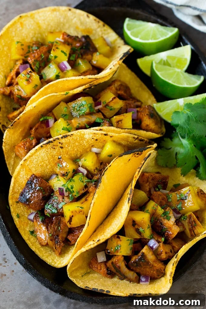 Tacos al Pastor Recipe | Pork Tacos | Mexican Tacos #tacos #pork #pineapple #grilling #tacotuesday #dinner #dinneratthezoo Tacos al pastor filled with marinated pork and pineapple.