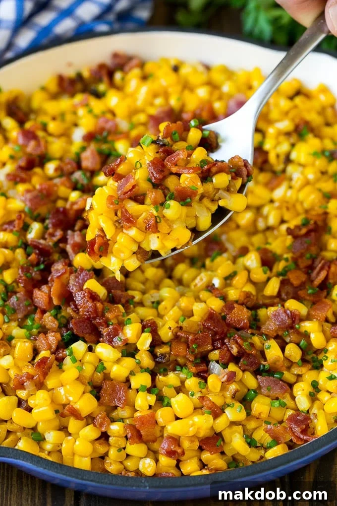 Bacon Fried Corn Recipe | Sauteed Corn | Corn Side Dish #corn #bacon #sidedish #glutenfree #dinner #dinneratthezoo A spoonful of fried corn made with bacon and onions.