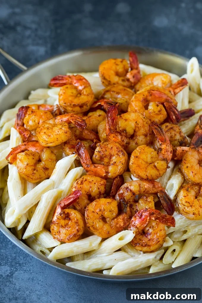 Cajun spiced shrimp over creamy pasta.