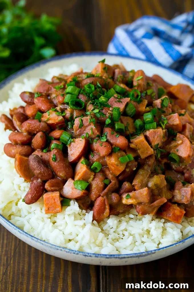 Red Beans and Rice Recipe | Red Beans and Sausage | Cajun Red Beans #beans #rice #sausage #ham #cajun #dinner #dinneratthezoo Red beans and rice with sausage, ham and vegetables, topped with herbs.
