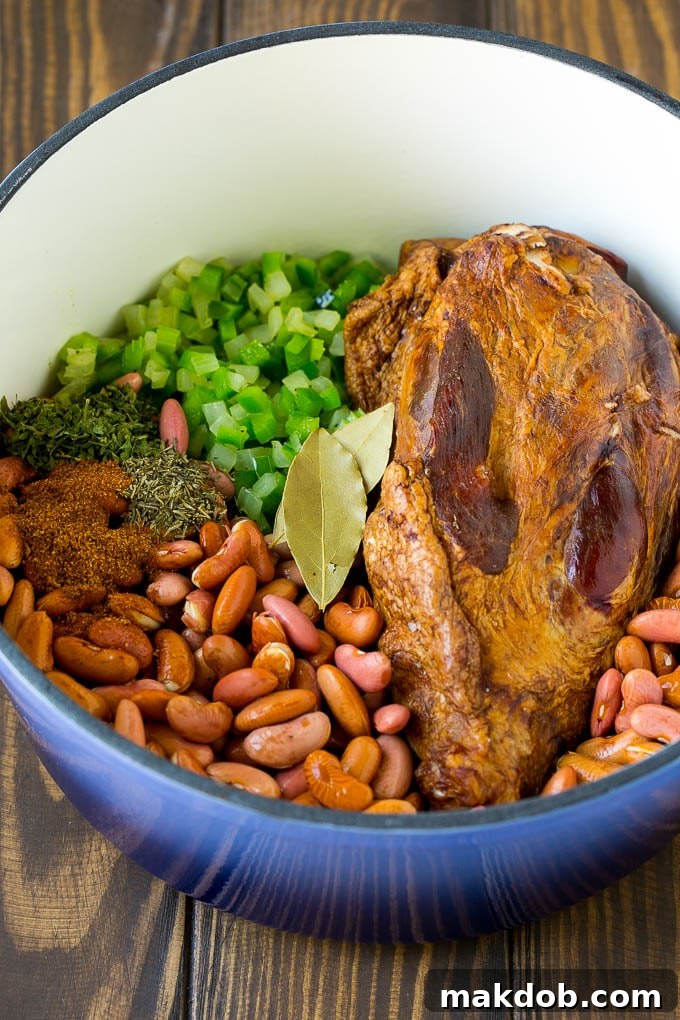 Red Beans and Rice Recipe | Red Beans and Sausage | Cajun Red Beans #beans #rice #sausage #ham #cajun #dinner #dinneratthezoo A pot of red beans with vegetables, seasonings and a ham hock.