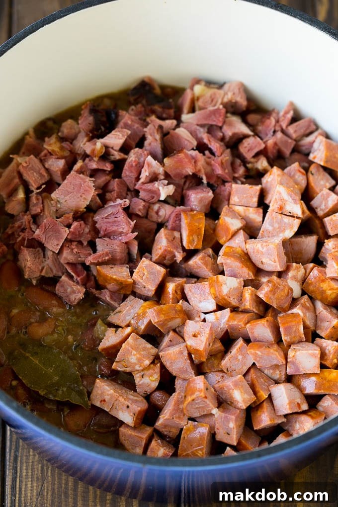 Red Beans and Rice Recipe | Red Beans and Sausage | Cajun Red Beans #beans #rice #sausage #ham #cajun #dinner #dinneratthezoo Cooked red beans topped with diced ham and sausage.