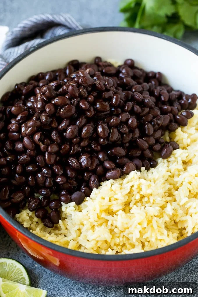 Black Beans and Rice Recipe | Cuban Black Beans | Beans and Rice #beans #rice #blackbeans #sidedish #glutenfree #dinner #dinneratthezoo Cooked rice and black beans in a pot.