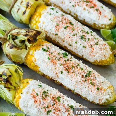Mexican street corn with mayonnaise, crema, cotija cheese and chili powder.