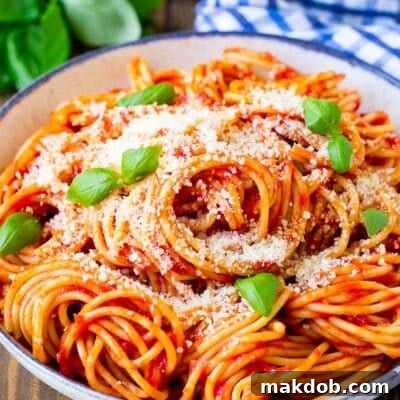 Simply Perfect Pasta Pomodoro 7 A serving bowl of pasta pomodoro garnished with fresh basil.