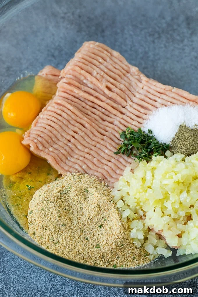Turkey Meatloaf Recipe | Healthy Meatloaf #meatloaf #turkey #dinner #dinneratthezoo Ground turkey, seasonings, breadcrumbs, onion and herbs in a mixing bowl.