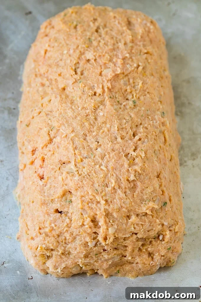 Simple Weeknight Turkey Meatloaf 2 A ground turkey mixture shaped into a loaf.