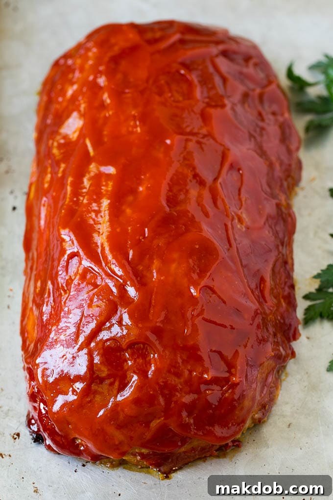 Simple Weeknight Turkey Meatloaf 3 A baked meatloaf topped with ketchup.