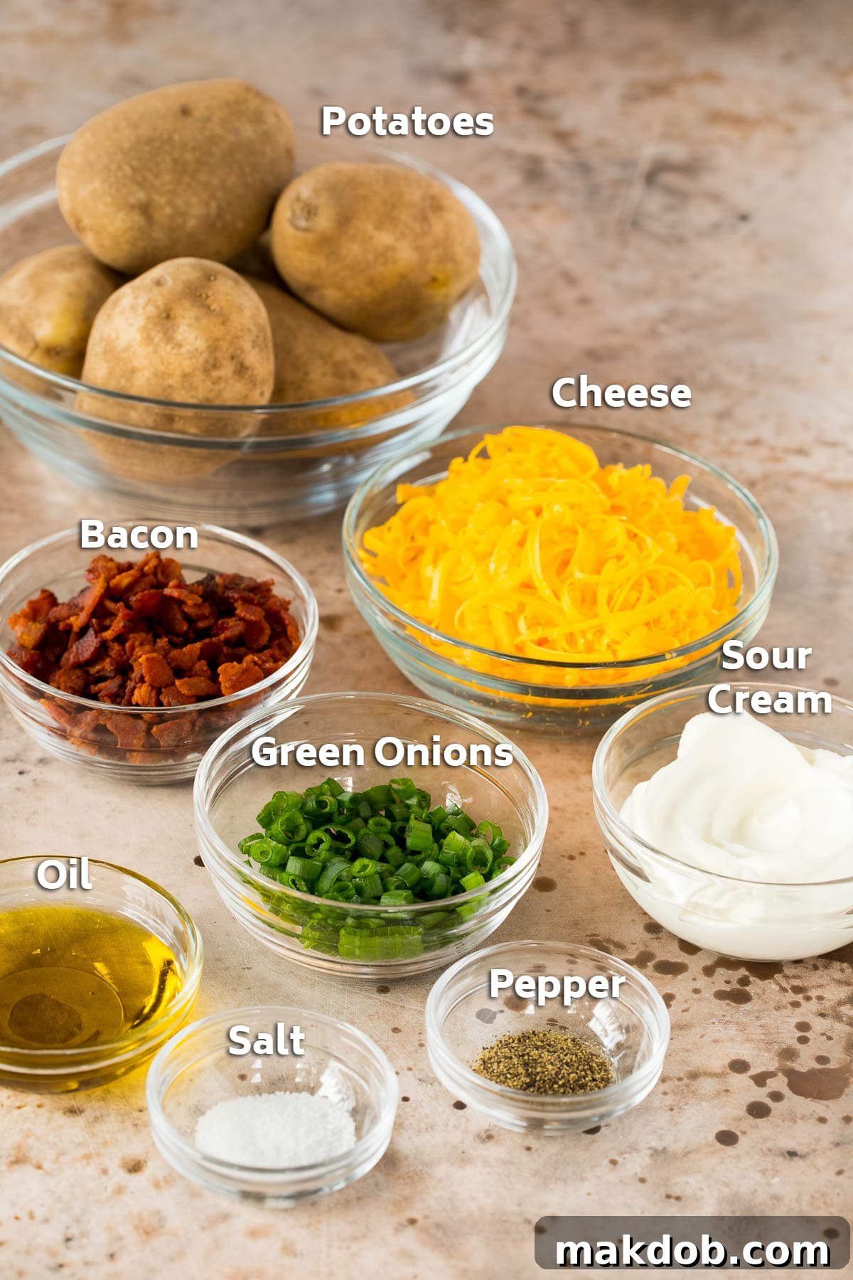 Ultimate Cheesy Bacon Potato Skins 2 Bowls of meticulously prepared ingredients including golden shredded cheese, seasoned olive oil, and perfectly cooked bacon crumbles, all ready to assemble into delicious potato skins.