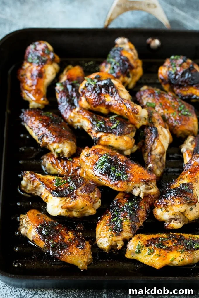 Chicken wings cooking on an indoor grill pan, achieving a perfect char.