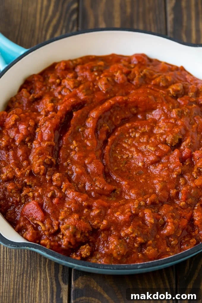 Zucchini Lasagna | Low Carb Lasagna #zucchini #lasagna #lowcarb #groundbeef #dinner #dinneratthezoo Meat sauce with ground beef and tomatoes in a skillet.