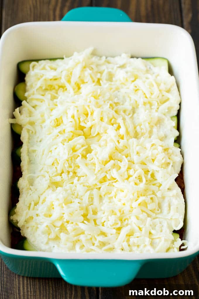 Zucchini Lasagna | Low Carb Lasagna #zucchini #lasagna #lowcarb #groundbeef #dinner #dinneratthezoo Layers of ricotta and mozzarella cheese in a baking dish.