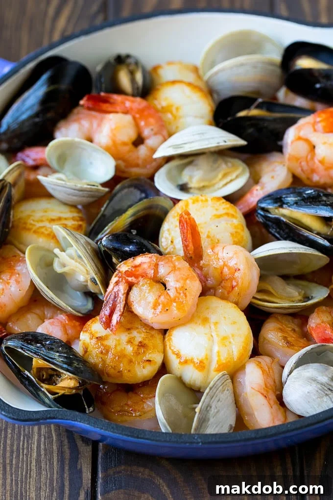 Cooked shrimp, scallops, mussels and clams.