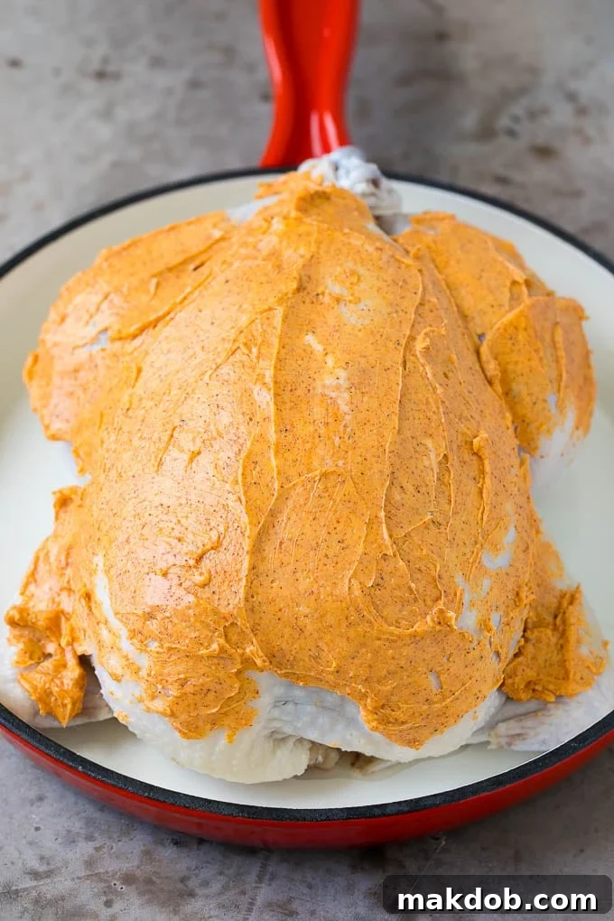 Chicken coated in butter and spices.