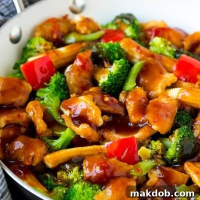 Hunan chicken with vegetables in a savory sauce.