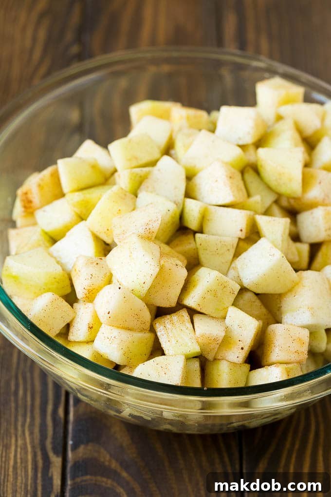 Apple Cobbler Recipe | Apple Dessert #apples #cobbler #dessert #baking #fall #dinneratthezoo Diced apples tossed with cinnamon and sugar.