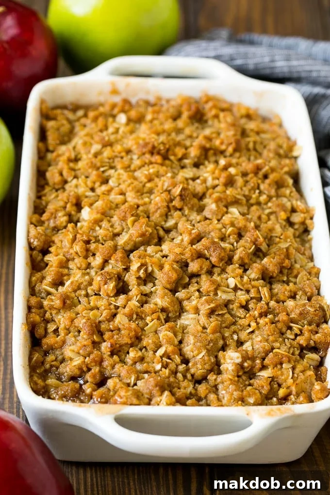 Apple Crisp Recipe | Apple Dessert #apples #dessert #baking #fall #dinneratthezoo A baked apple crisp with an oatmeal and walnut topping.