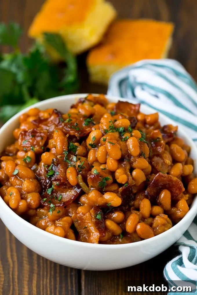 Smoky Bacon Baked Beans 6 A bowl of baked beans made with bacon and brown sugar sauce.