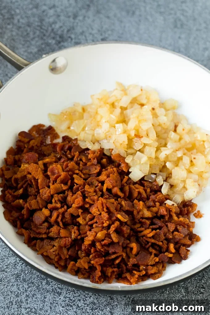 Crock Pot Baked Beans | Slow Cooker Baked Beans #beans #bacon #slowcooker #crockpot #dinneratthezoo Cooked bacon and onions in a pan.